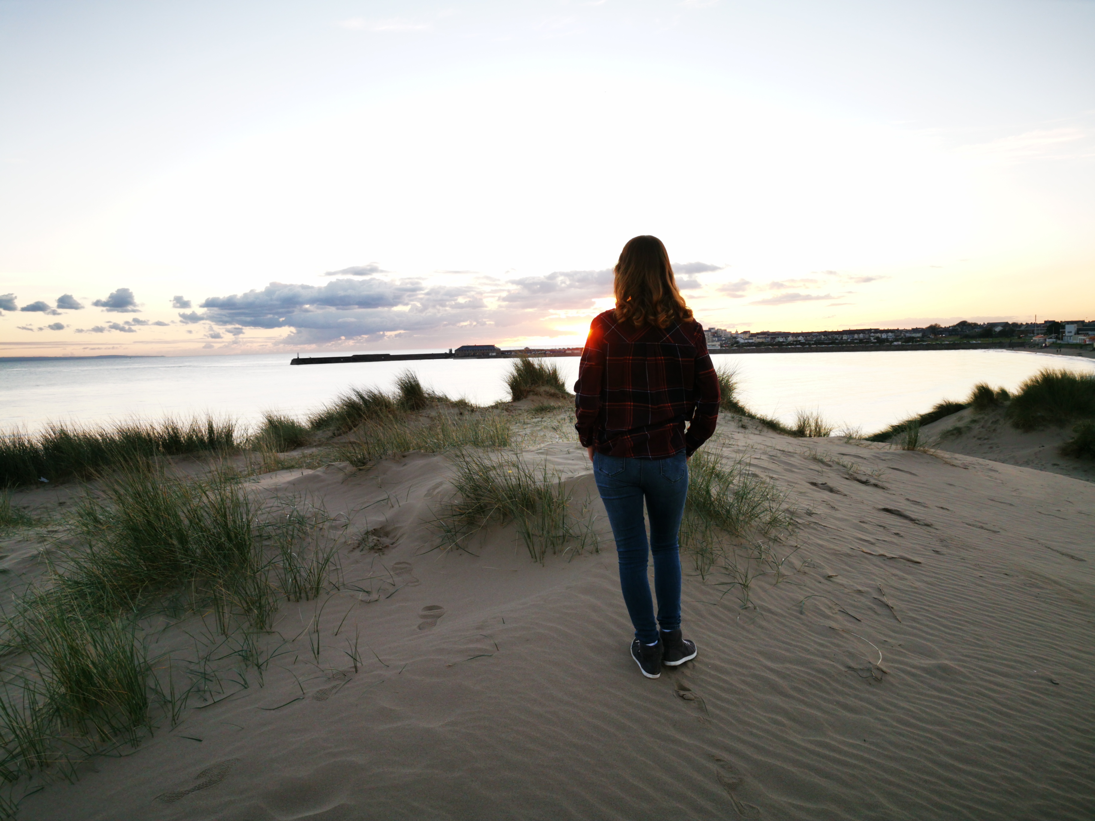 I was really worried about cyberbullying- ID: sarah looking out across the sea as the sun goes down