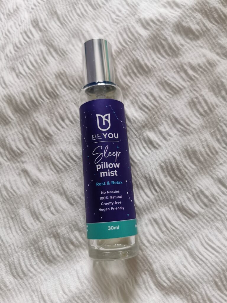 BeYou Pillow Mist lying on a cream duvet cover