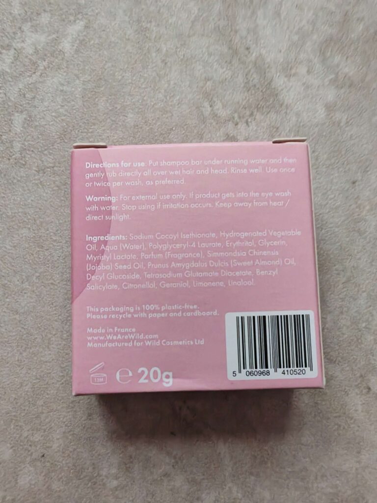 Pink shampoo bar packaging with usage directions, ingredients, and recycling info. Eco-friendly, biodegradable, plastic-free.