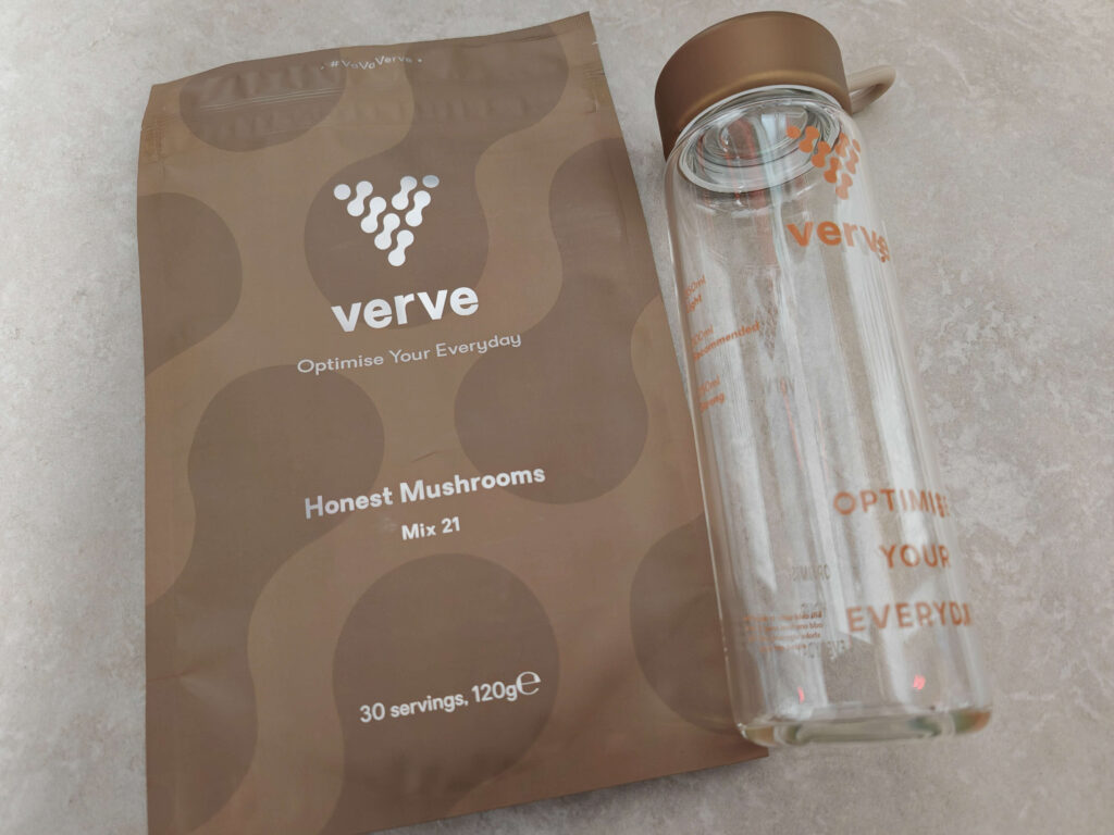 Verve Honest Mushrooms Mix 21 packaging with branded glass bottle on grey background.
