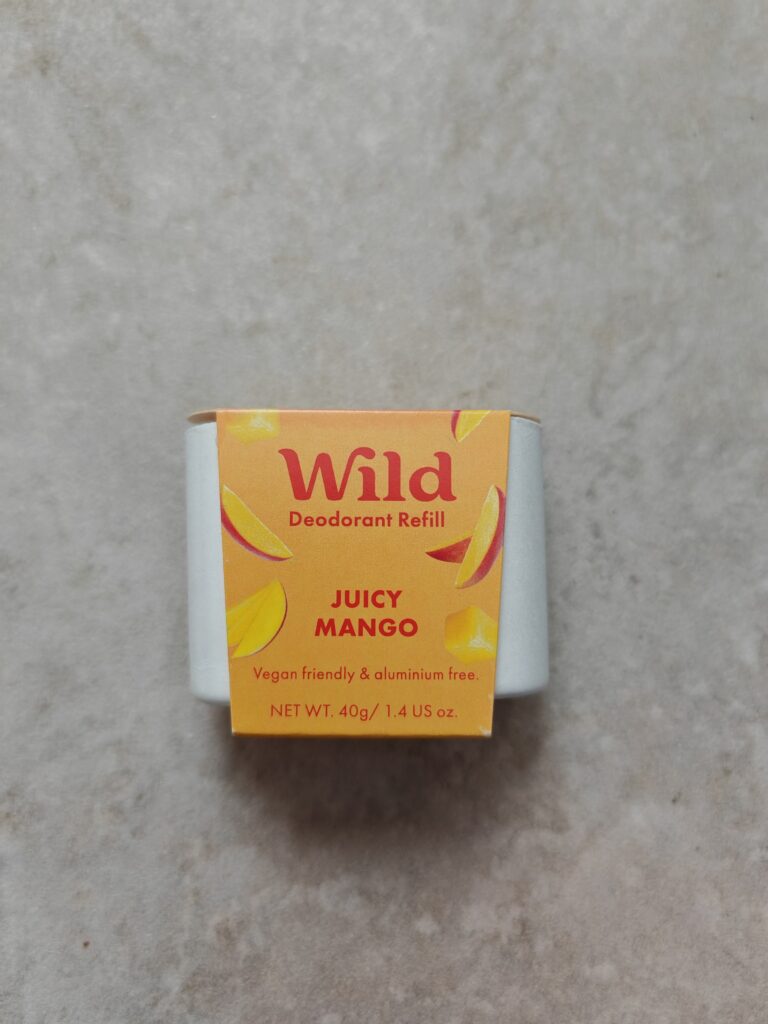 Juicy Mango Wild deodorant refill, vegan and aluminium-free, 40g, on a grey background, eco-friendly packaging.