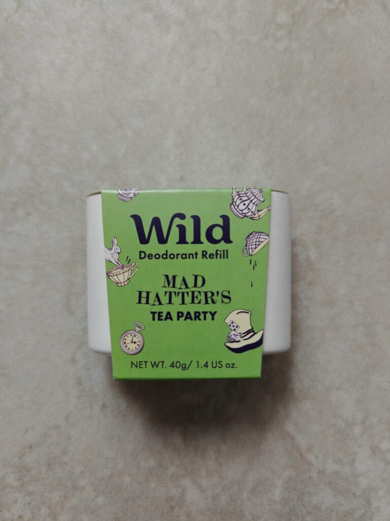 Wild Deodorant Refill in Mad Hatter's Tea Party scent, 40g green packaging on a beige background.