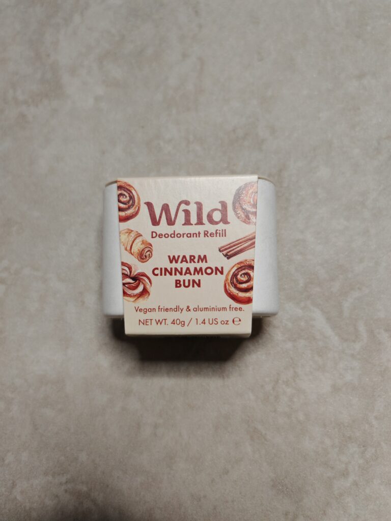 Wild deodorant refill packaging, Warm Cinnamon Bun scent, vegan and aluminium free on light background.