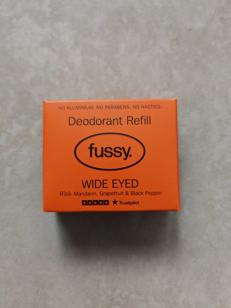 Orange Fussy deodorant refill box, Wide Eyed scent, featuring mandarin, grapefruit, and black pepper.