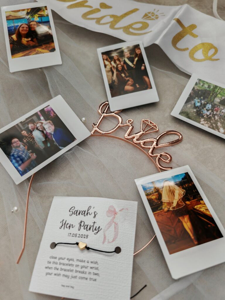 Polaroid photos and a bride sash at a bachelorette party with Sarah's Hen Party card visible.