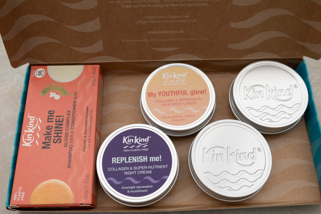 KinKind skincare set with moisturiser, night cream, and shampoo bar in eco-friendly packaging. Plastic-free UK brand.