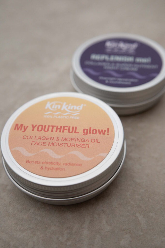 Plastic-free KinKind moisturiser tins for youthful glow and hydration, featuring collagen and moringa oil.