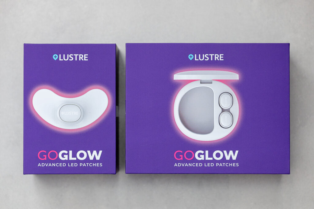 Lustre GoGlow Advanced LED Patches in purple boxes, showcasing innovative skincare technology.