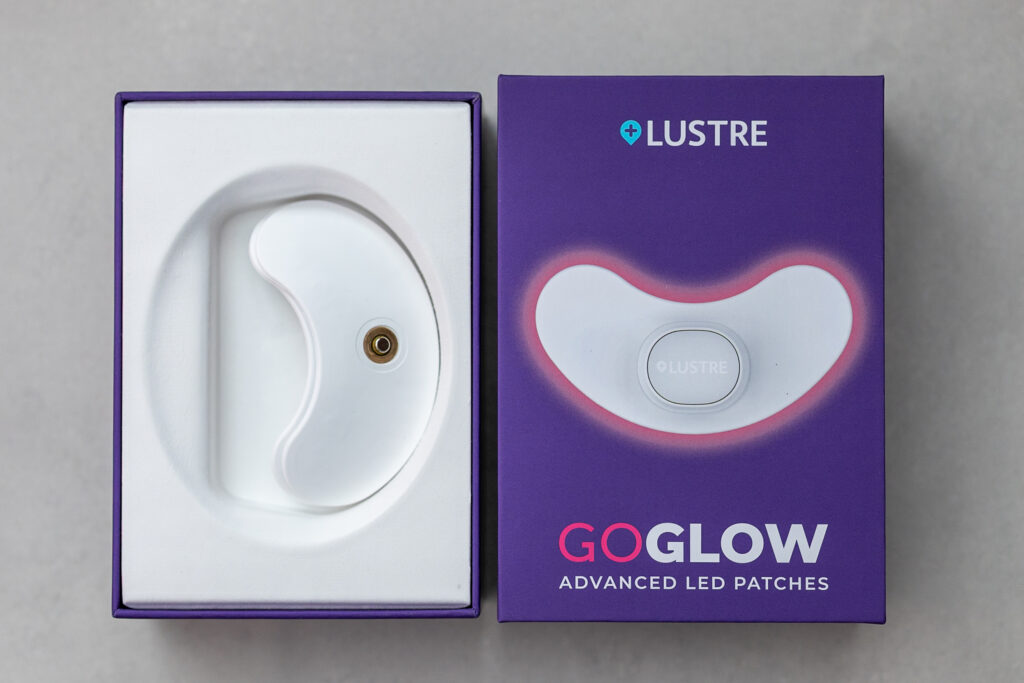 Lustre GoGlow LED patches in packaging, promoting advanced skin care technology for acne treatment.