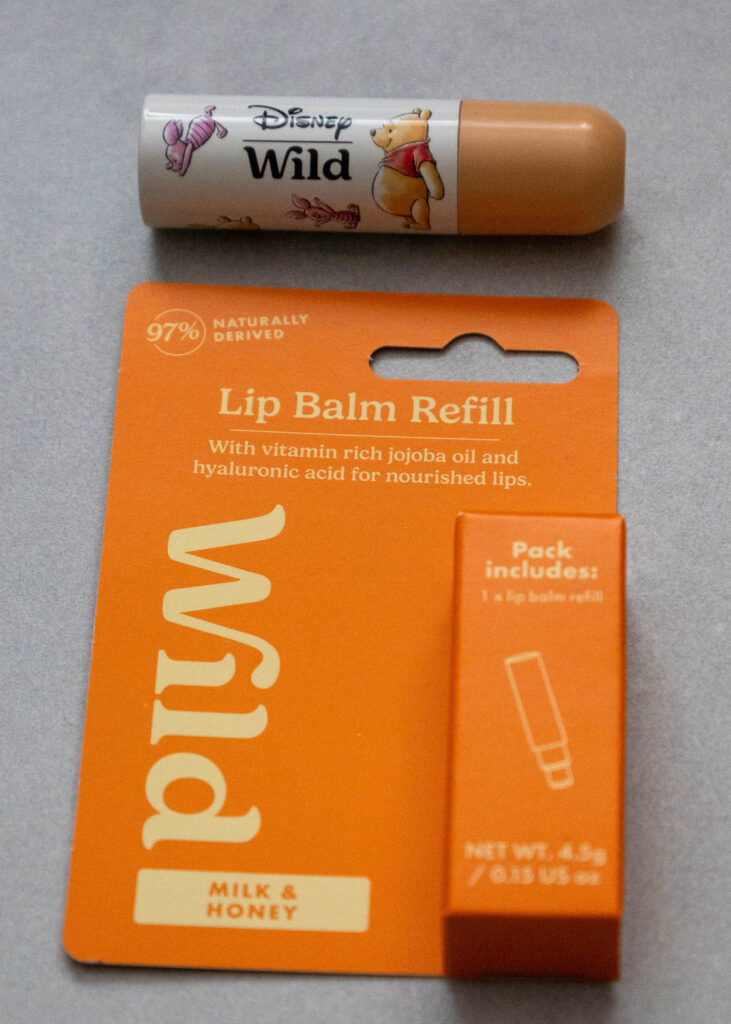 Disney Wild lip balm and refill pack with milk and honey, enriched with jojoba oil for nourished lips.