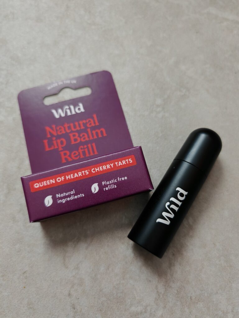 Natural lip balm refill and case by Wild, featuring cherry tarts scent, eco-friendly and plastic-free packaging.